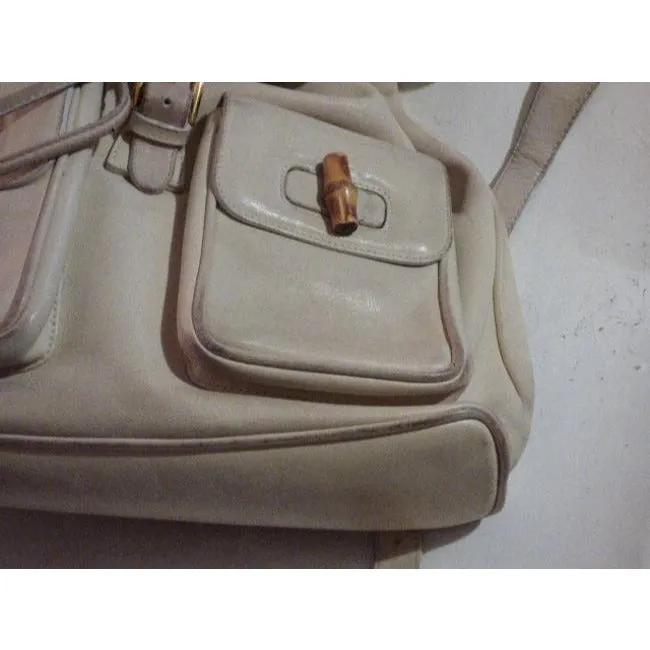 Gucci, white leather, larger size, two strap and bamboo handle, drawstring top, multi-pocket, messenger bag/backpack