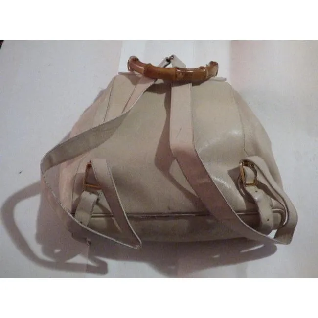 Gucci, white leather, larger size, two strap and bamboo handle, drawstring top, multi-pocket, messenger bag/backpack