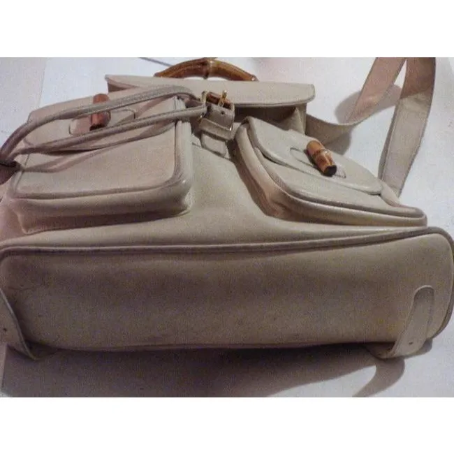 Gucci, white leather, larger size, two strap and bamboo handle, drawstring top, multi-pocket, messenger bag/backpack