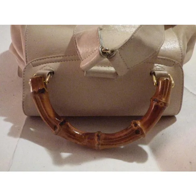 Gucci, white leather, larger size, two strap and bamboo handle, drawstring top, multi-pocket, messenger bag/backpack