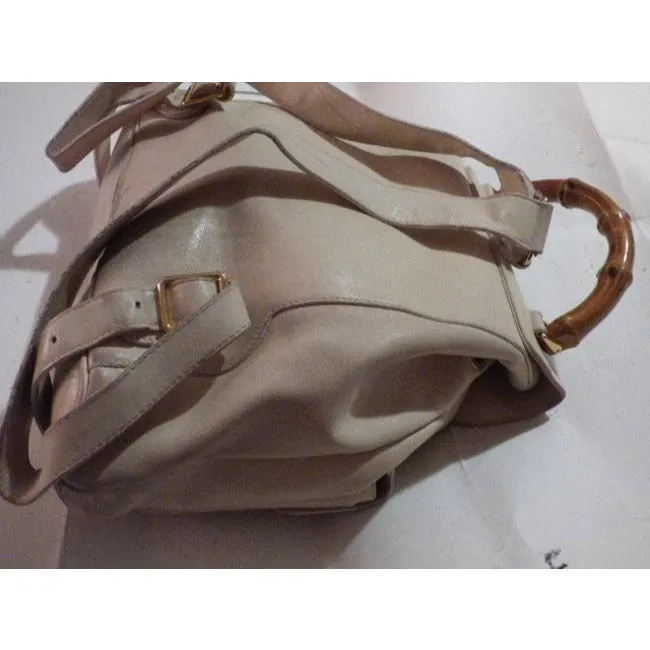 Gucci, white leather, larger size, two strap and bamboo handle, drawstring top, multi-pocket, messenger bag/backpack
