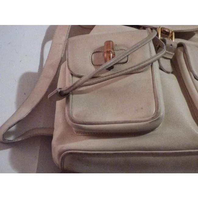 Gucci, white leather, larger size, two strap and bamboo handle, drawstring top, multi-pocket, messenger bag/backpack
